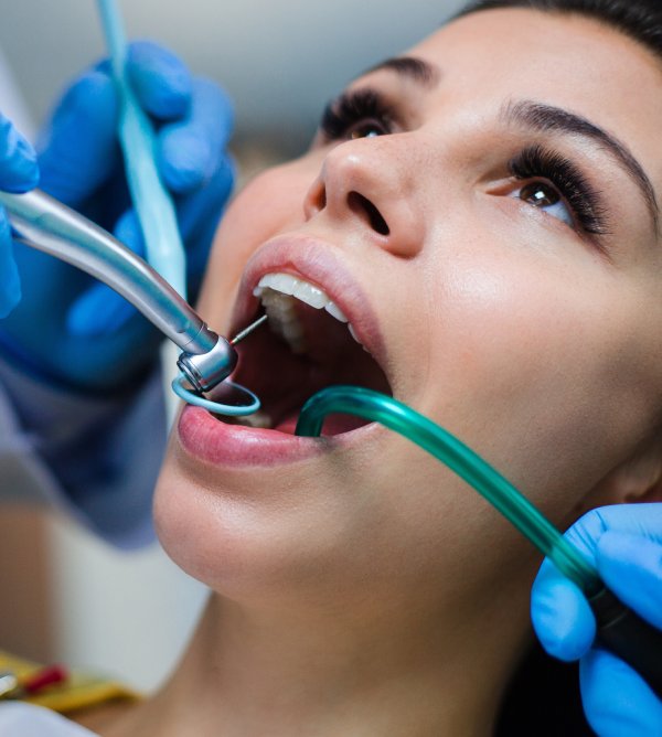 man smiling in dentists chair