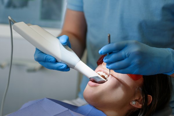 man smiling in dentists chair