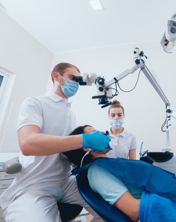 man smiling in dentists chair