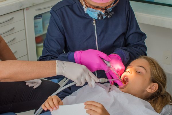 man smiling in dentists chair