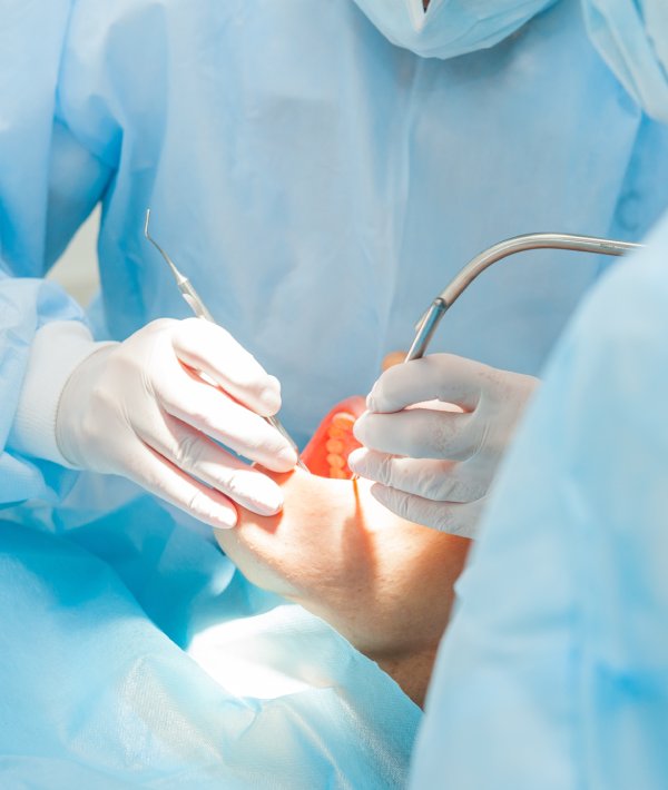 man smiling in dentists chair