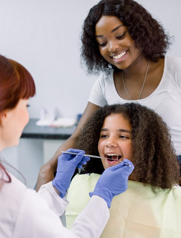 man smiling in dentists chair