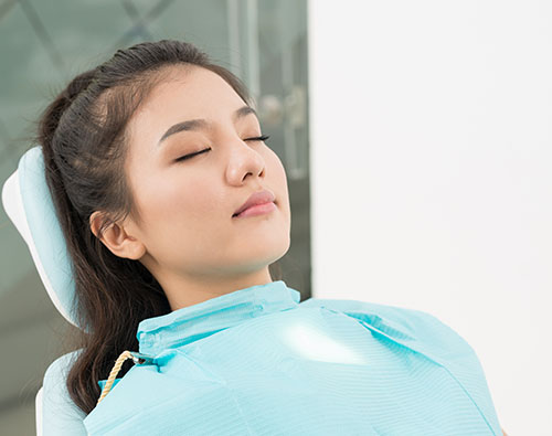 man smiling in dentists chair